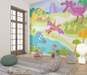 A playful dinosaur wall mural with bright cartoon-style dinosaurs, a volcano, greenery, and prehistoric elements in a kids' room.