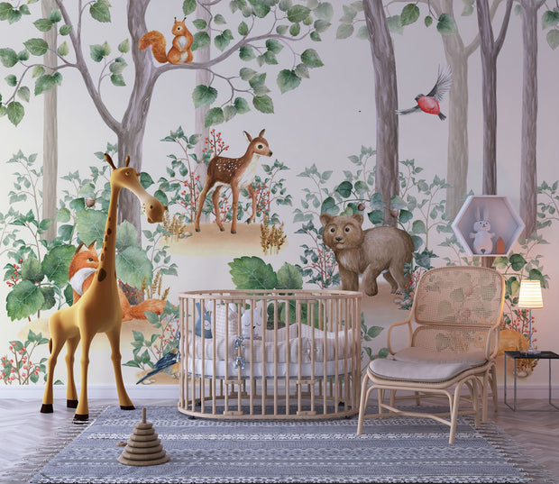 Woodland-themed wall mural featuring a bear cub, deer, squirrel, birds and lush green trees, decorating a cozy children's bedroom with a wooden house bed and natural decor.