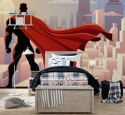 Wall mural depicting a superhero in a red cape looks over the city.
