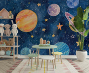 Hand-painted watercolor-style wall mural of planets, stars, and a dreamy blue galaxy, ideal for decorating kids’ bedrooms or playrooms.
