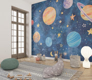 Hand-painted watercolor-style wall mural of planets, stars, and a dreamy blue galaxy, ideal for decorating kids’ bedrooms or playrooms.