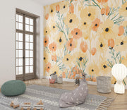 Bright poppy floral wall mural with bold yellow, orange, and green accents in a kid's playroom.