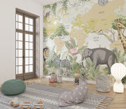 Children's world map wall mural with illustrated safari animals and tropical plants, styled in modern nursery setting.