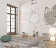 Adorable cat ballerina mural in soft pastel colors, showing three dancing cats in tutus with the phrase "Let's Dance" above them, decorating a children’s play area.