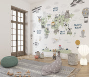Scandinavian style children's world map wall mural with cute animals and airplanes, styled in a kid's playroom.