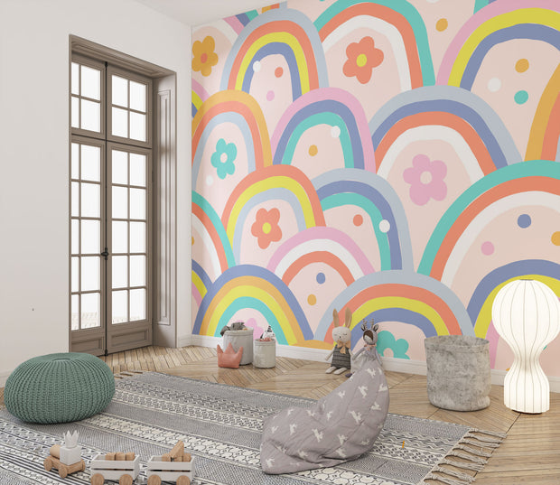 Kids wall mural with retro-style rainbow arches and colorful flowers in a playful, children's playroom.