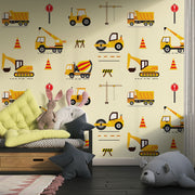 Excavators and dumpers wall mural featuring yellow trucks, cranes, diggers, and traffic cones on a light background, perfect for a boy's bedroom.