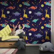 Space Dinosaurs Wall Mural featuring colorful astronaut dinosaurs, planets and stars; decorating kid's bedroom.