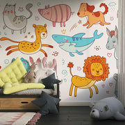 Colorful cartoon animal wall mural in a children's playroom featuring a fox, lion, bunny, shark, elephant, and more