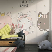 Adorable cat ballerina mural in soft pastel colors, showing three dancing cats in tutus with the phrase "Let's Dance" above them, decorating a children’s play area.