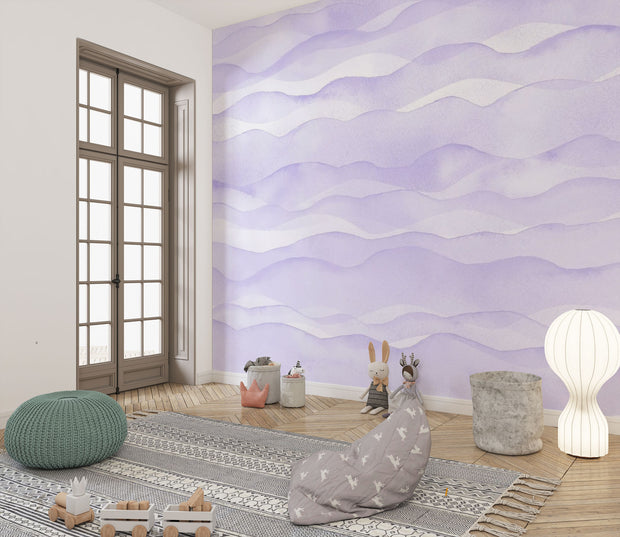 Purple wave-pattern wall mural with soft flowing designs, decorating a cosy children’s playroom.