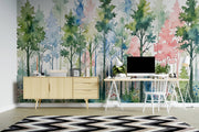 Modern office setup with a colorful forest mural on the wall.