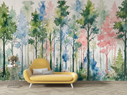 Yellow sofa in front of a colorful forest mural on a wall.