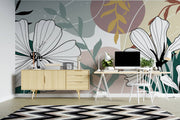 Modern room interior with a decorative wall mural featuring abstract floral designs.